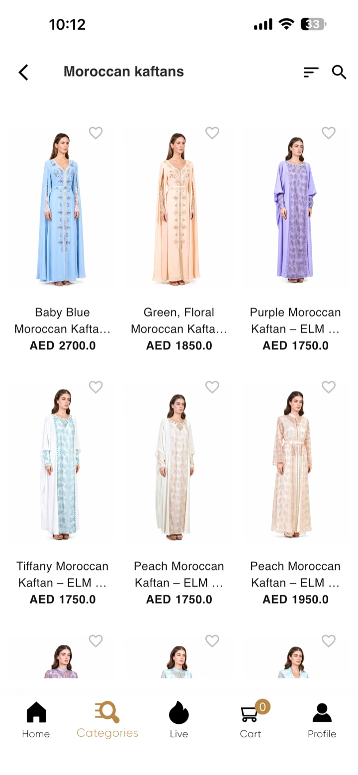 Eleganza La Mode app product grid of Moroccan kaftans, each with a wishlist heart and a price in AED